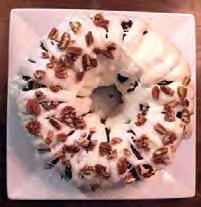 Carrot Bundt Cake CAKE: 2 cup granulated sugar 1 cup canola oil 4 large eggs 2 cup all-purpose flour 1 tsp baking soda 1 tsp baking powder 2 tsp cinnamon 2 cup shredded carrots 1 cup Fisher Chopped