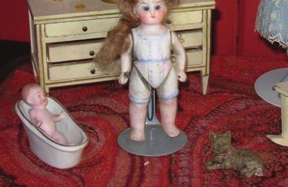 From an early age, she adored dolls and was encouraged by her mother to make