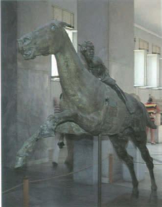 A bronze racehorse was also recovered from the sea at Artemision; the rider and the foreparts of the horse appeared in 1928, and the horse's hindquarters were netted by a fisherman in 1937 [FIGURE