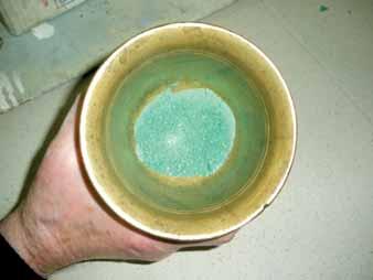 Pounded malachite to obtain a vivid green pigment. A field where, despite scarce analyses, much information is available since varnishes are easily seen on objects.