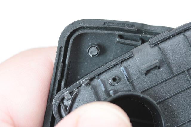 Being mindful of tolerances between parts is important. Manufacturers often set a high priority on making devices slim and smooth; this relief (below) was needed to make room for the battery.