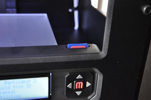 right slot just behind the door On the MakerBot, go to