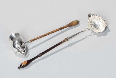 7 Two George II Sterling Silver Toddy Ladles, London, each with turned handles, one with shell-form bowl with engraved armorial and monogram, 1745-46, by Philip Goddard, lg.