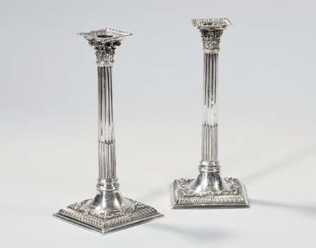 $1,000-1,500 9 Pair of George II Sterling Silver Candlesticks, London, 1759-60, William Café, maker, removable bobeche with engraved crest, with Corinthian capital sconce on a reeded columnar stem