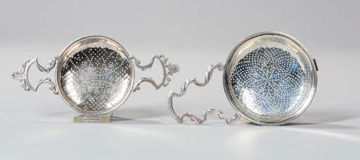 , approx. 11.4 troy oz. total. $200-400 15 Two George II/III Sterling Silver Strainers, London, each with distinct marks, two lemon strainers: one with two handles possibly c. 1745, lg.
