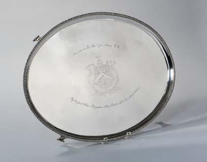 68 George III Sterling Silver Salver, London, 1808-09, Paul Storr, maker, the shell and scroll rim centering an engraved rocaille surface with engraved crest to center, on four bracket feet, dia.