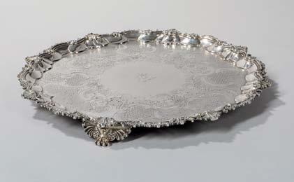 $2,000-3,000 69 George III Sterling Silver Salver, center bearing marks for London, 1808-09, Paul Storr, rim later, unmarked, with central engraved coat of arms and four reticulated feet, dia.