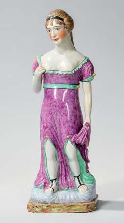 450 Large Staffordshire Pearl-glazed Earthenware Figure of a Maiden, England, early 19th century, polychrome enamel decoration, modeled standing and holding the end of her robe in one hand, the other