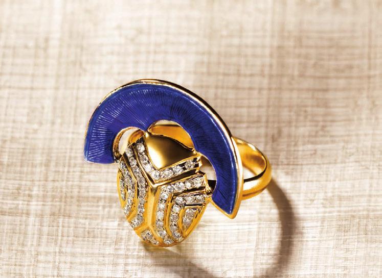 The auspicious scarab beetle is lauded with white diamonds while a burst of