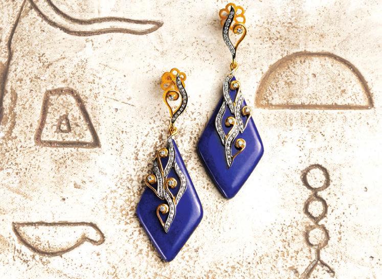 This elegant necklace and earring set combines brilliant cut diamonds and lapis lazuli to