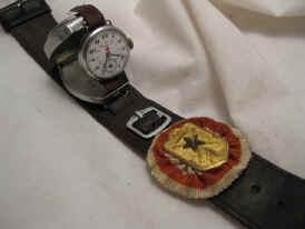 GOOGLE GOLDSMITHWORKS JAPANESE NAVAL AIR CHRONO, TO THE RIGHT IS A 1916-18 RED CROSS SEIKOSHA WATCH.