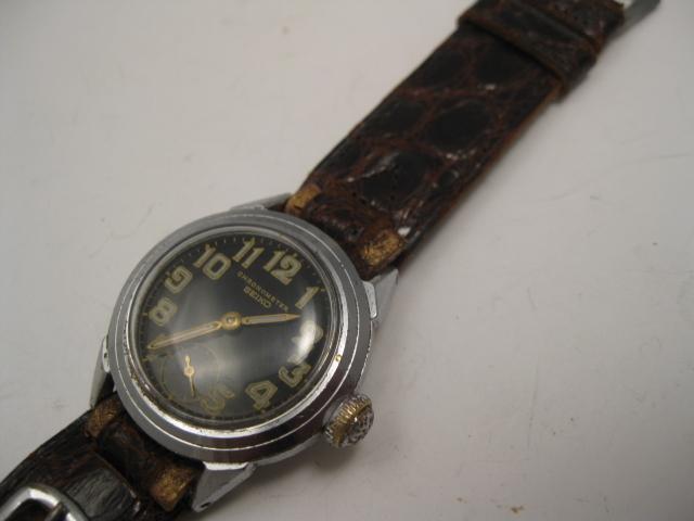 THIS BEAUTY HAS A 1942 STRAP, A EARLY 1920'S POCKET WATCH WITH WIRE LUGS AND A 1935 MILITARY COMPASS A DOUBLE CASED