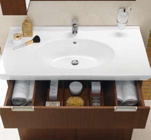 Available in teak or white lacquered MDF, Form 500+ keeps busy bathrooms uncluttered with a series of special storage solutions, including a washing