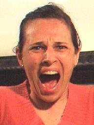 Even in full scream, her mouth has an upturned look from her Zygomatics (c), similar to her anger scream (inset).