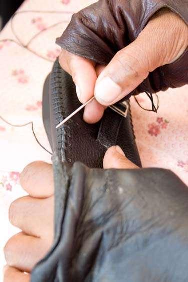 by AIDS. Froggie Footwear in South Africa, where unemployment is approx 40%, trains previously unemployed and un-skilled women to stitch shoes and footballs.