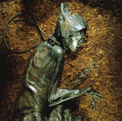 source 2 Tollund Man, a body found in a peat bog in Bjaeldskovdal in Denmark. He was strangled and thrown in the bog where he lay for the next 2000 years.