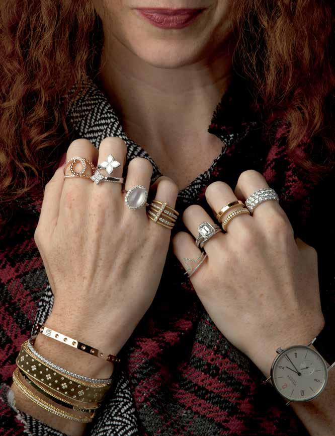 Rings on her fingers: Tirisi diamond open ring, 18K, $2160. Roberto Coin diamond Princess Flower ring, 18K, $2250. Moonstone and diamond ring, 14K, $3165. Carelle Moderne diamond ring, 18K, $4500.