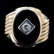 As of: 2/10/2014 Page: 40 487 488 489 490 491 492 Diamond, Black Onyx, 10k Yellow Gold Ring. Centering one round-cut diamond weighing approximately 0.15 ct.