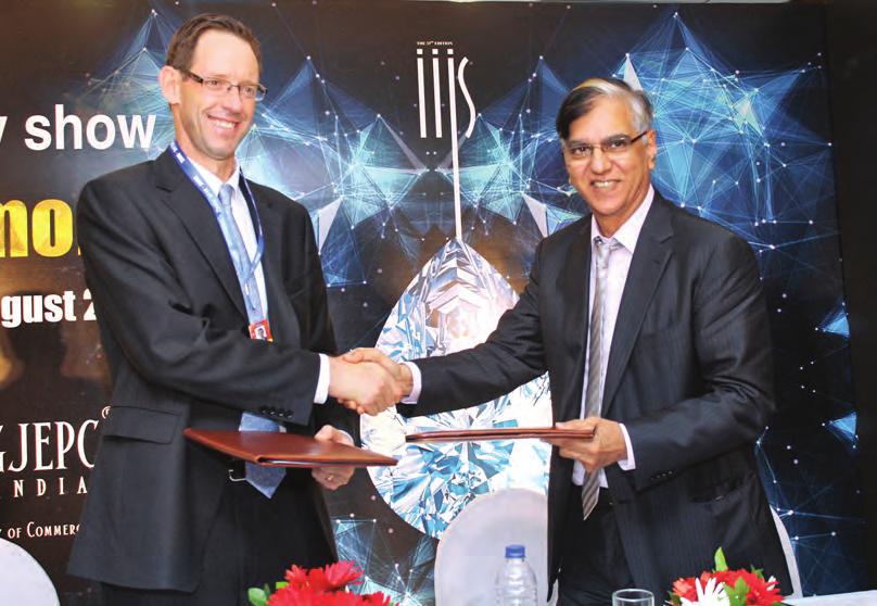 De Beers Bruce Cleaver and GJEPC s Praveenshankar Pandya sign the MoU to kickstart the generic diamond promotion campaign Jewel Ace in their orders.
