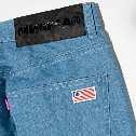 5oz Denim with 2% stretch featuring woven flag label on back pocket, Mishka paper fiber label waist label.