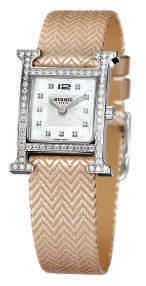 $5,275 7 : H-our ladies with steel and diamond case, white mother of pearl dial with diamond
