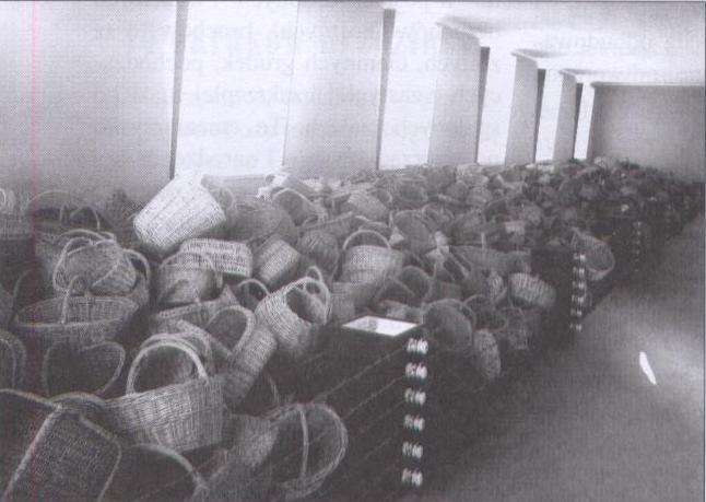 Fig. 43 Anonymous Photograph, Fragment of the First Exhibition, Domestic Baskets Belonging to Deportees to