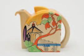 593 594 595 597 593 A Clarice Cliff Bizarre teapot and cover in the Japan pattern of Stamford shape decorated in pencil outline with an oriental gazebo amongst trees picked out in yellow, orange,
