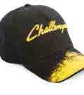 BRUSHED CAP Black Challenger cap with yellow colour gra- dient on the peak. Challenger embroidery on the front and grey piping on the peak. Clasp for size adjustment with engraved logo.