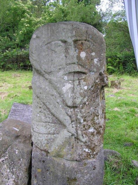 Reverse side of figure In the southern half of Ireland there are several Ogham Stones.