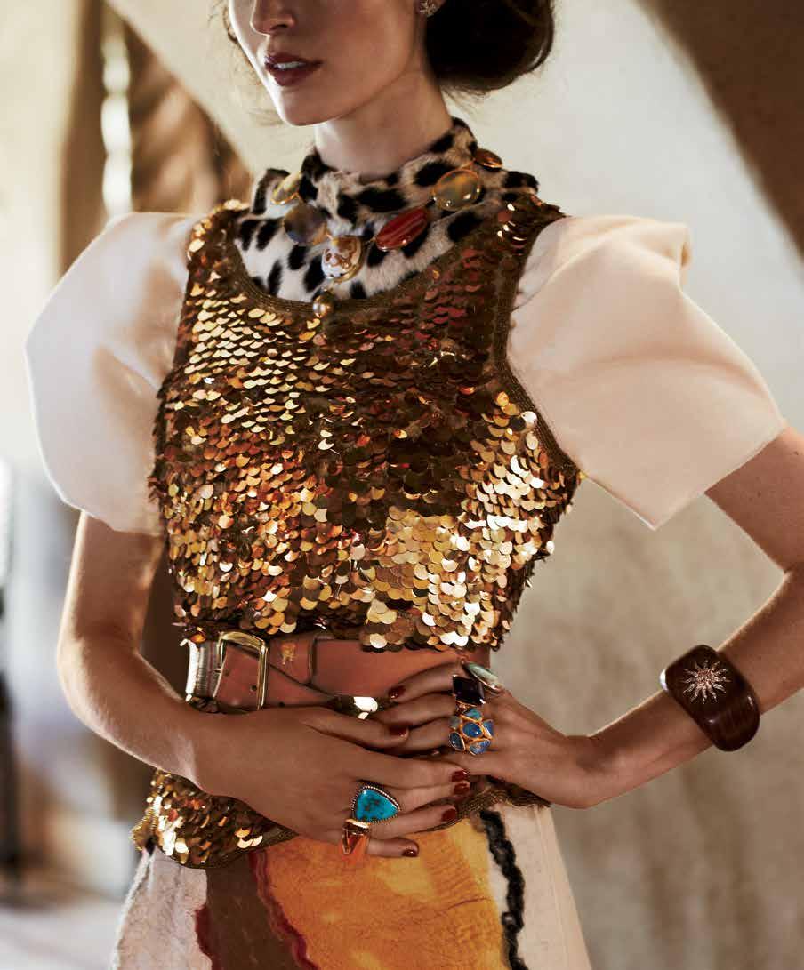 arielle de pinto hair fork, $520. marco bicego earrings, $3,940. fred leighton citrine necklace, price upon request. shiprock santa fe Navajo necklace, $1,200, Tand pin (on belt), $480.