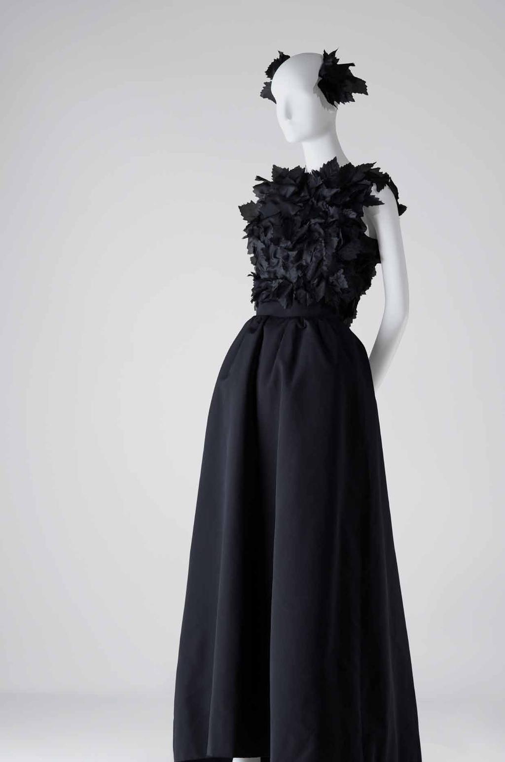 Mrs. Mellon and her World Evening outfit composed of a fitted bodice decorated with black silk organza vine leaves and a skirt in black faille. balenciaga. paris. February 1968. cbm 2014. 245ac.