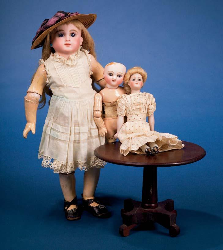 1012 1008 1011 711 1001. Seven Small All-Bisque Dolls, mostly Germany, five jointed at shoulders and hips, two at shoulders only, a character girl with molded hair, and others, ht. 3-7 1/4 in.