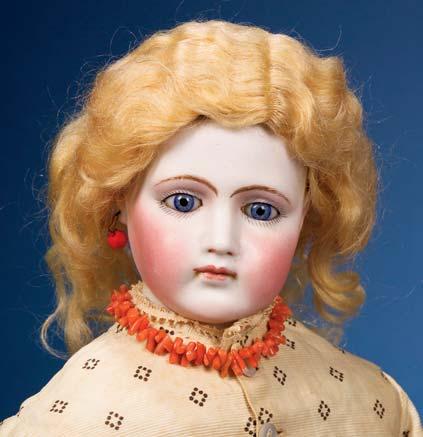 1009. Swivel Head Bisque Doll, impressed Made in Germany 7, with closed mouth, later fixed blue eyes, blonde mohair wig, kid-lined neck socket, and unusual body with cloth torso, kid-over-wood