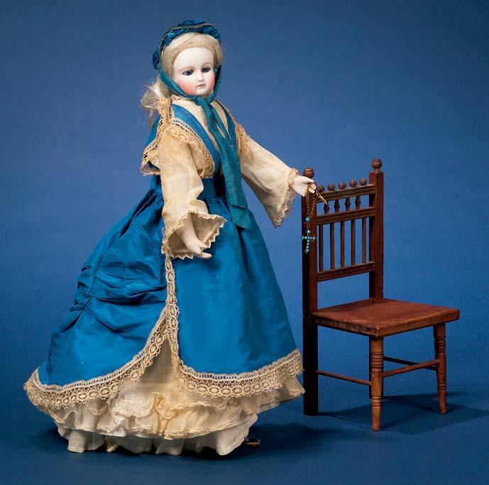 arms and bisque lower arms, cone-shaped wheeled carton base forming the skirt, the going-barrel movement causing the doll to walk forwards, raise her arms and cry mamma, in the original two-piece