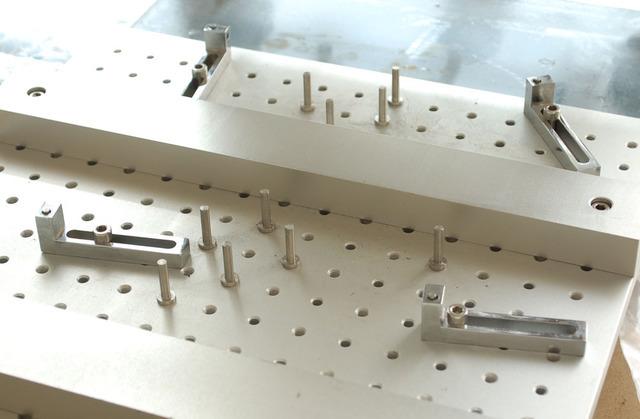 We get our PCB house to place 4 x 3mm holes in each corner of our PCB panel.