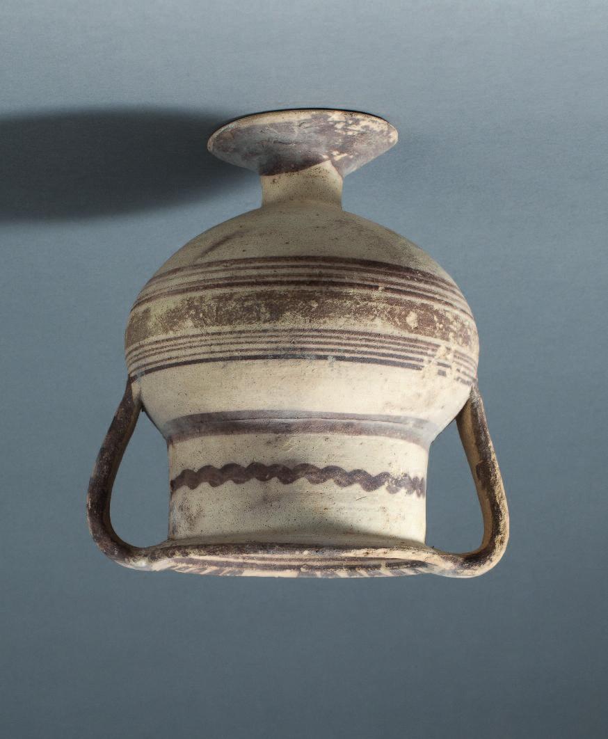44 Cypriot bichrome ware neck amphora set on a splayed foot, the strap handles projecting horizontally from the lip and curving back to attach to the shoulder.