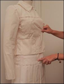 The toile modified by P1 was shown to the designer and the designer wanted the collar to stand up more.