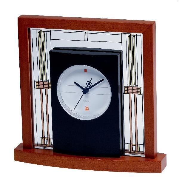B1929 ANNETTE II Formed wood case, mahogany finish. Westminster melody on the hour. Polished goldtone bezel.