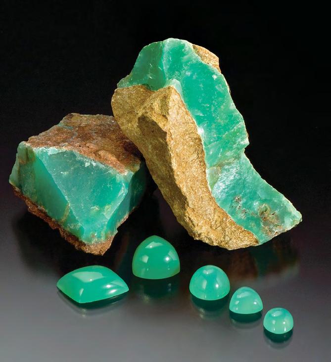 Figure 1. Tanzanian chrysoprase (left, cabochons ranging from 3.72 to 18.42 ct) and prase opal (inset, 35.82 ct) are commercially mined from one deposit near Haneti.