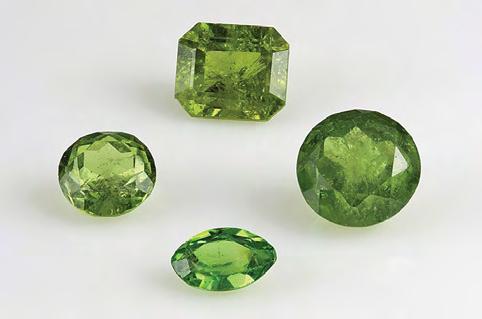 inclusions of what was probably a serpentine-group mineral (e.g., antigorite; see figure 5, left), as documented by Gübelin and Koivula (2005) in demantoid from this locality. Chemical Composition.