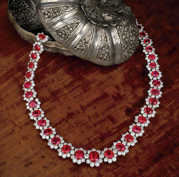 Figure 1. Fine rubies and sapphires are among the most coveted of all gems. This ruby and diamond necklace is set with 39 unheated Burmese rubies (83.73 ct total weight; the largest is 5.00 ct).