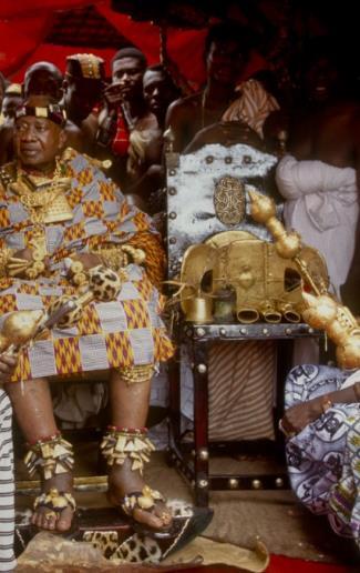 Here the current Asantehene, or ruler, is shown seated next to the stool. This exhibits the balance of the head of state with the spirit of the nation.