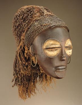 Female [Pwo] mask Late 19 th to early 20 th century Wood, fiber, pigment, and metal Chokwe peoples [Democratic
