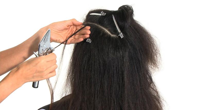 Gently slide the added hair and ring down the natural