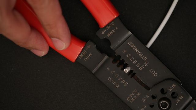 Use a 16 gauge wire stripper to remove about 2cm of