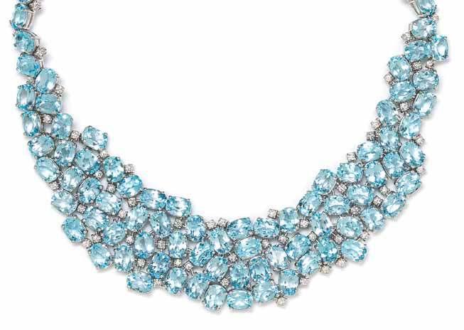 247 250 249 248 247 an 18 Karat White Gold, Blue topaz and diamond necklace, antonini, in a bib style, containing 97 oval mixed cut natural blue topaz weighing approximately 125.