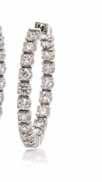 252 251 253 254 251 an 18 Karat White Gold and diamond longchain, containing 51 round brilliant cut diamonds weighing approximately 4.50 carats total. Stamp: K18. 7.80 dwts.