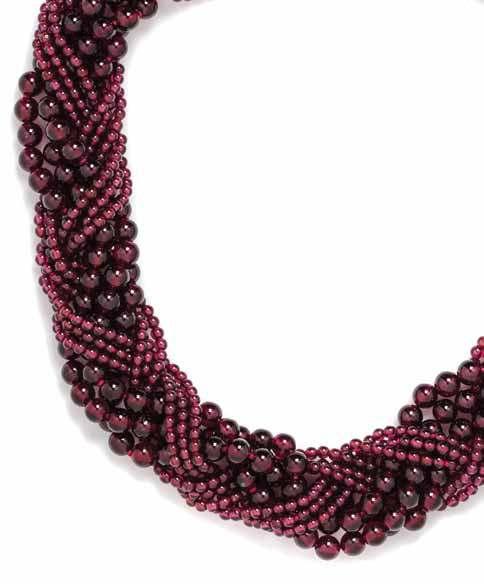 272 271 273 271 an 18 Karat Yellow Gold and multistrand Garnet Bead necklace, angela cummings for Tiffany & Co., consisting of nine strands of rhodolite garnet beads measuring approximately 3.06-6.