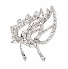 304 306 305 303 304 an 18 Karat White Gold and diamond charm Bracelet with Four attached charms, Bulgari, consisting of a cable link bracelet suspending four charms including a snowflake, a barrel