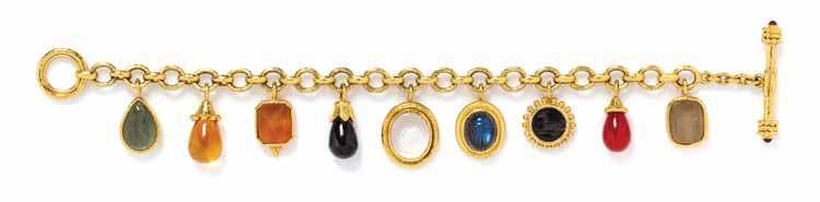 317 319 320 318 317 a 19 Karat Yellow Gold and multigem Intaglio charm Bracelet, Elizabeth locke, consisting of a hammered textured bracelet suspending a rectangular